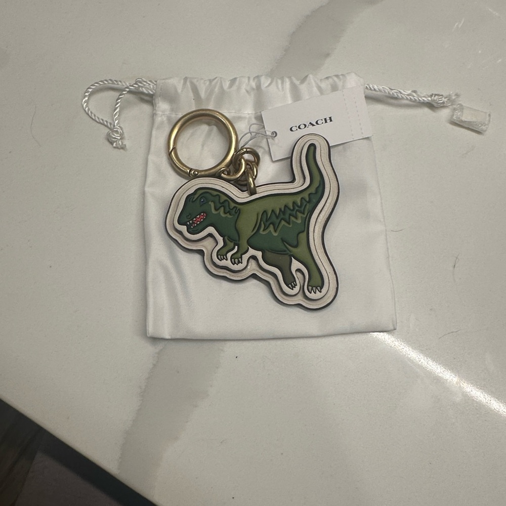 Coach Green Dinosaur Keychain with Gold Accents